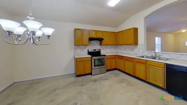 a kitchen with a sink and cabinets