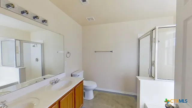a bathroom with a sink a mirror and a shower