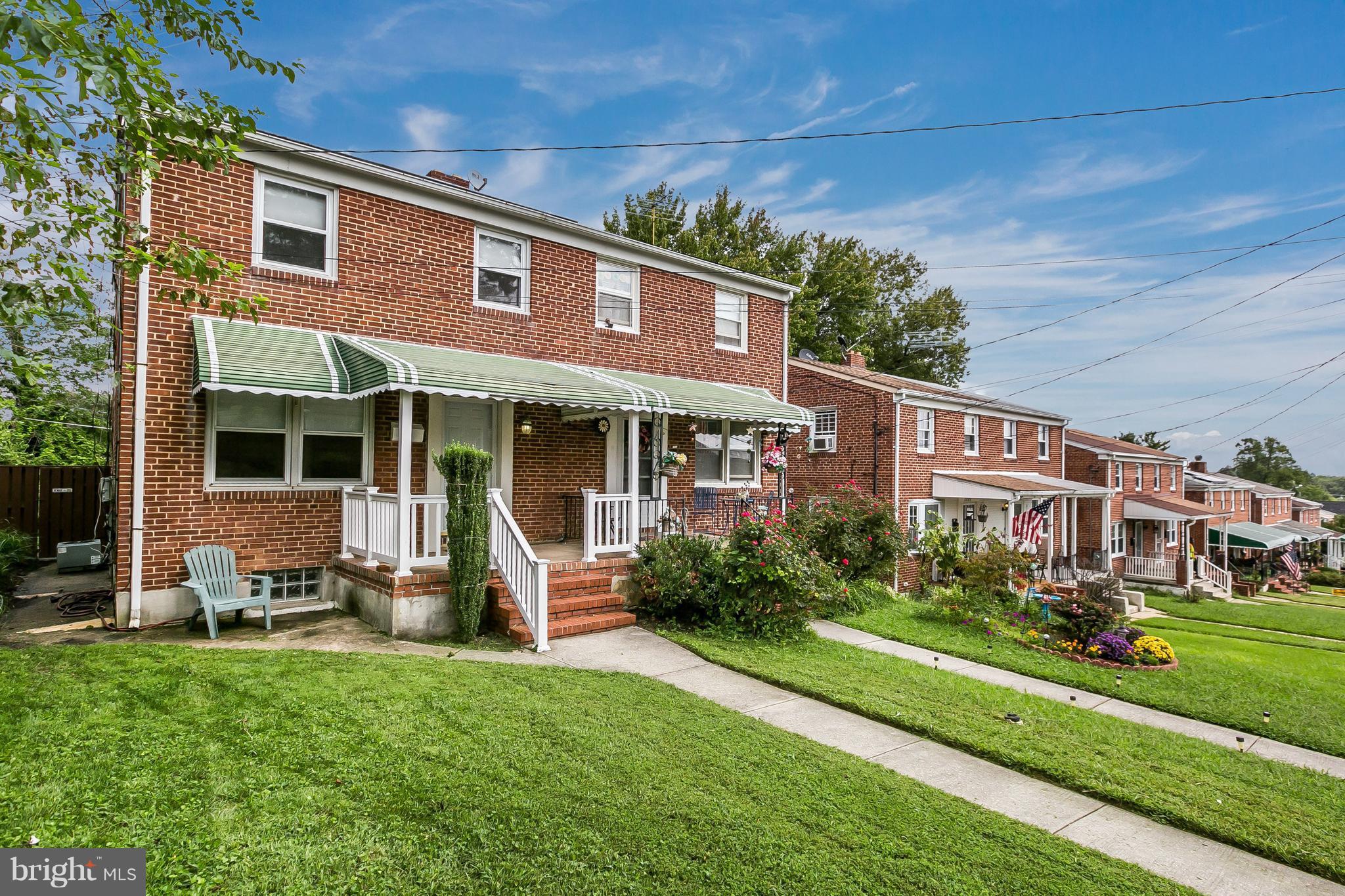 2802 Topaz Road Baltimore, MD 21234 - Photo 1 of 15 a front view of a house with garden and porch
