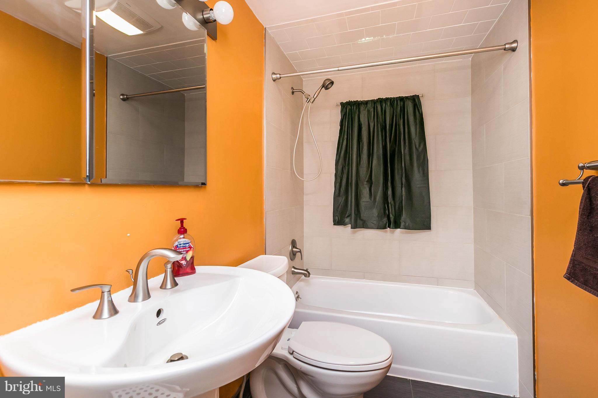 2802 Topaz Road Baltimore, MD 21234 - Photo 11 of 15 a bathroom with a sink a toilet and shower