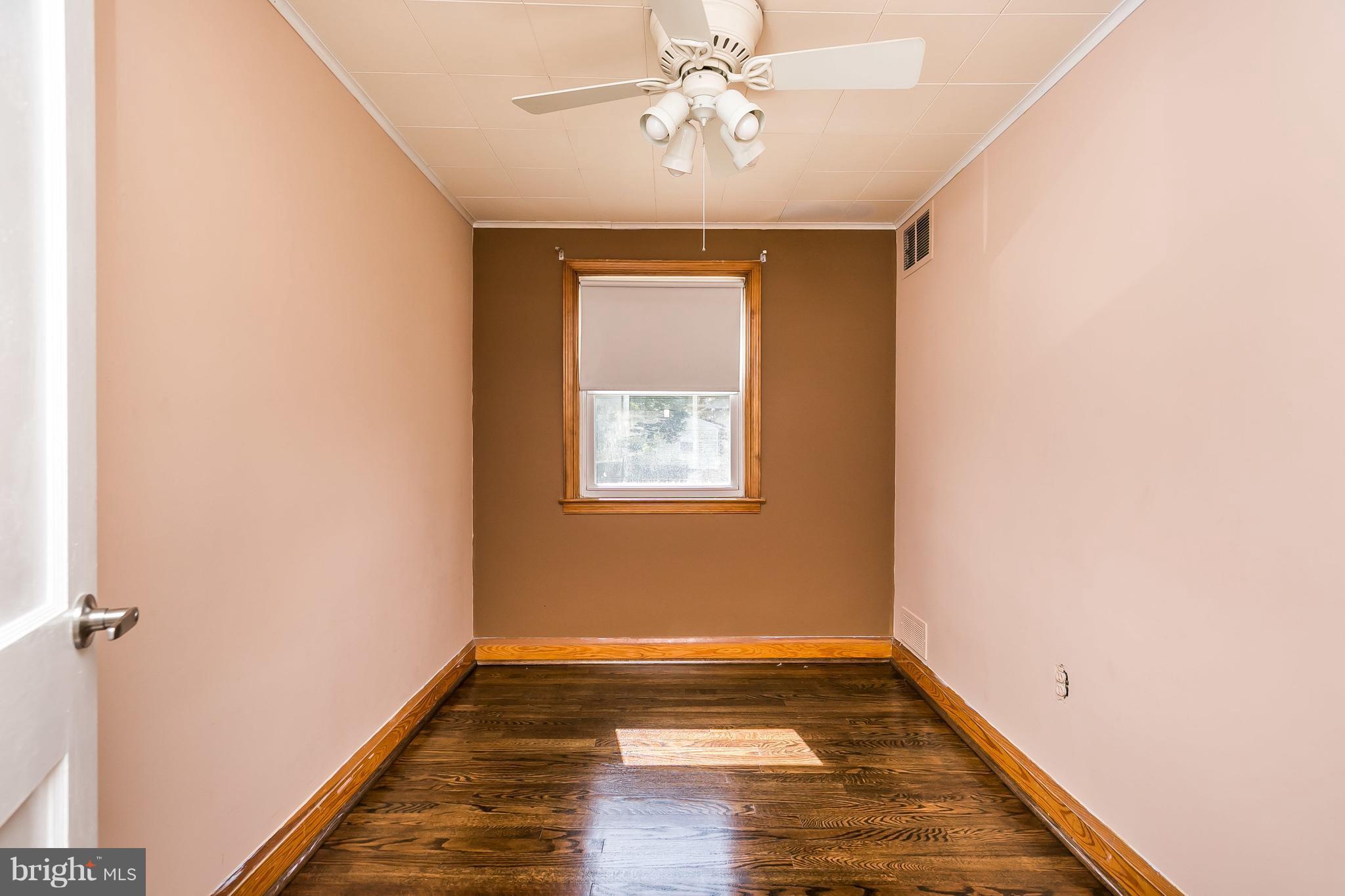 2802 Topaz Road Baltimore, MD 21234 - Photo 12 of 15 a view of empty room with wooden floor and fan