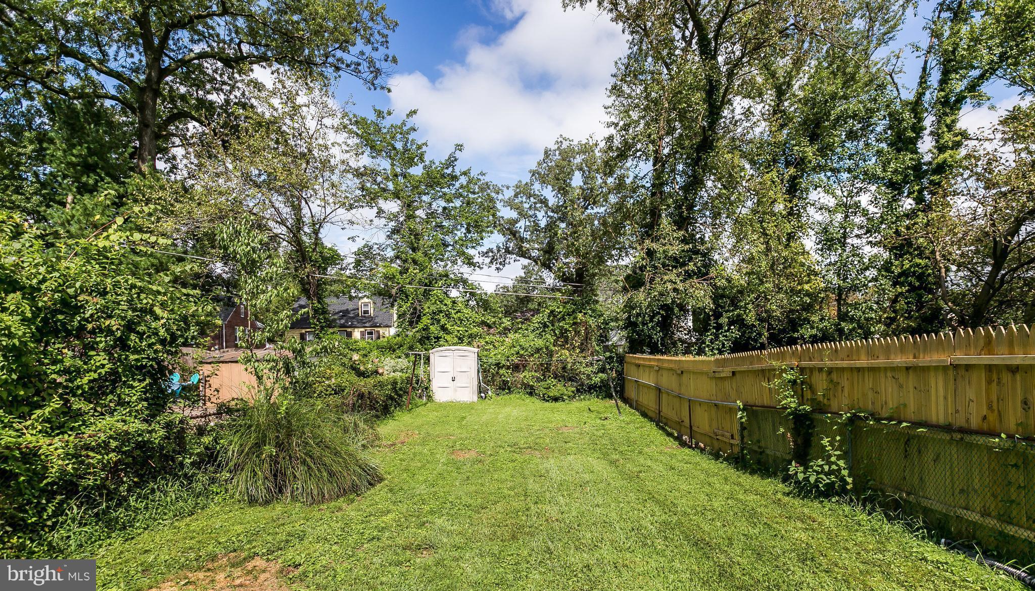 2802 Topaz Road Baltimore, MD 21234 - Photo 15 of 15 a view of a lush green field with wooden fence