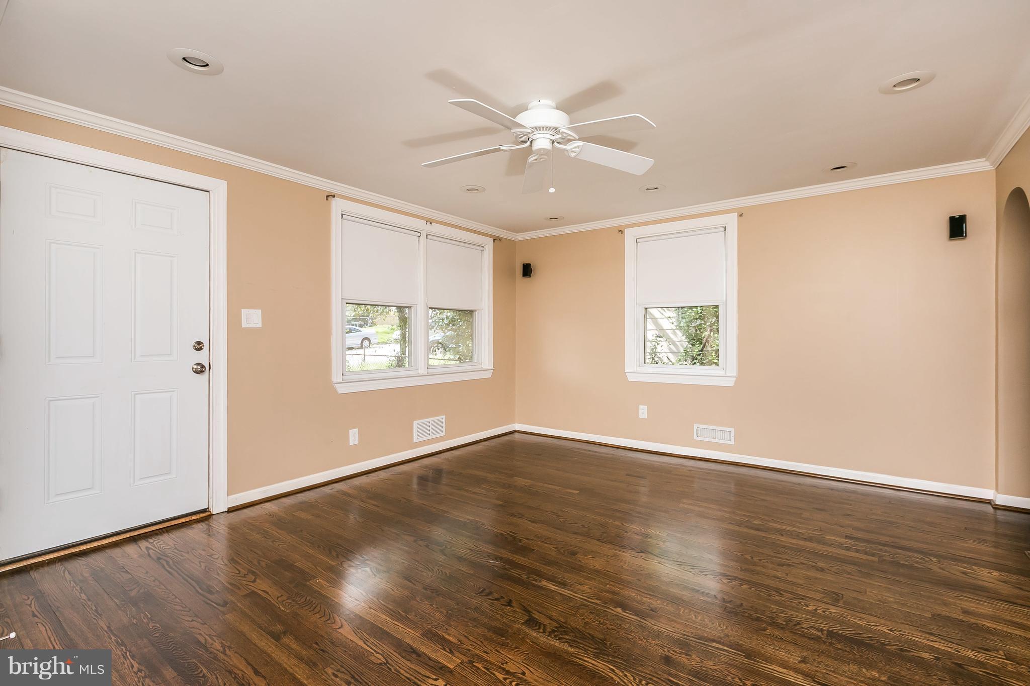2802 Topaz Road Baltimore, MD 21234 - Photo 4 of 15 a view of an empty room with wooden floor and a window