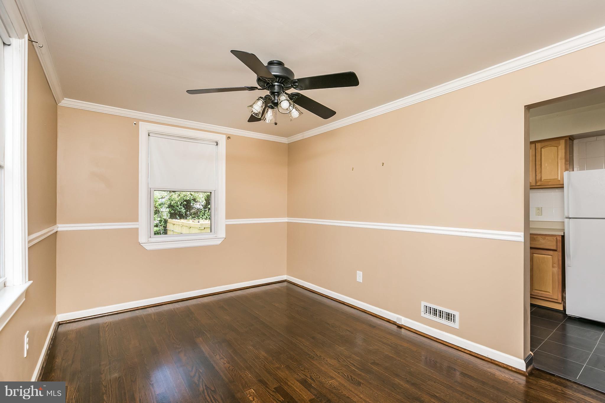 2802 Topaz Road Baltimore, MD 21234 - Photo 8 of 15 a view of a room with wooden floor and ceiling fan