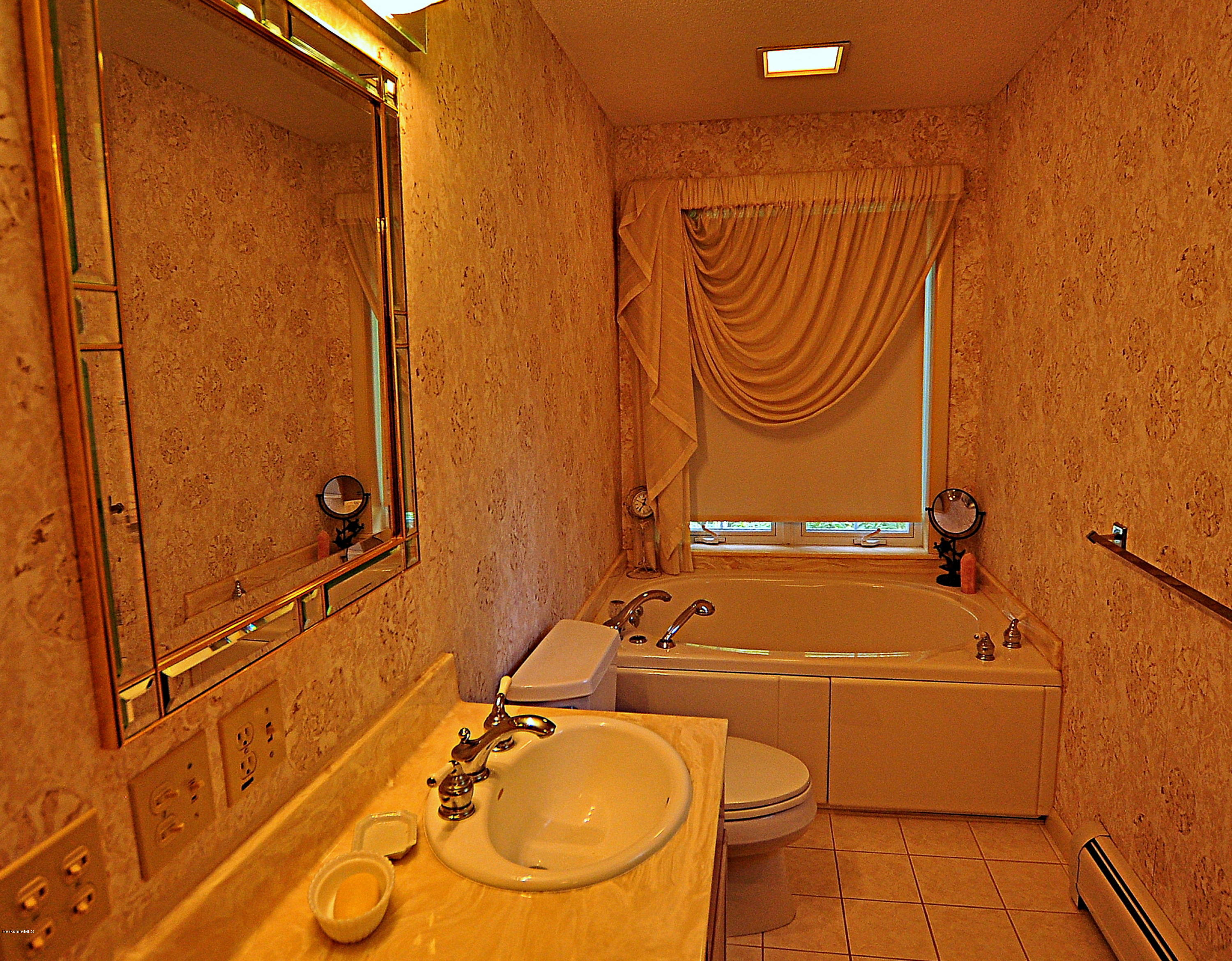 783 Algerie Road Otis, MA 01008 - Photo 22 of 44 a bathroom with a sink and a shower