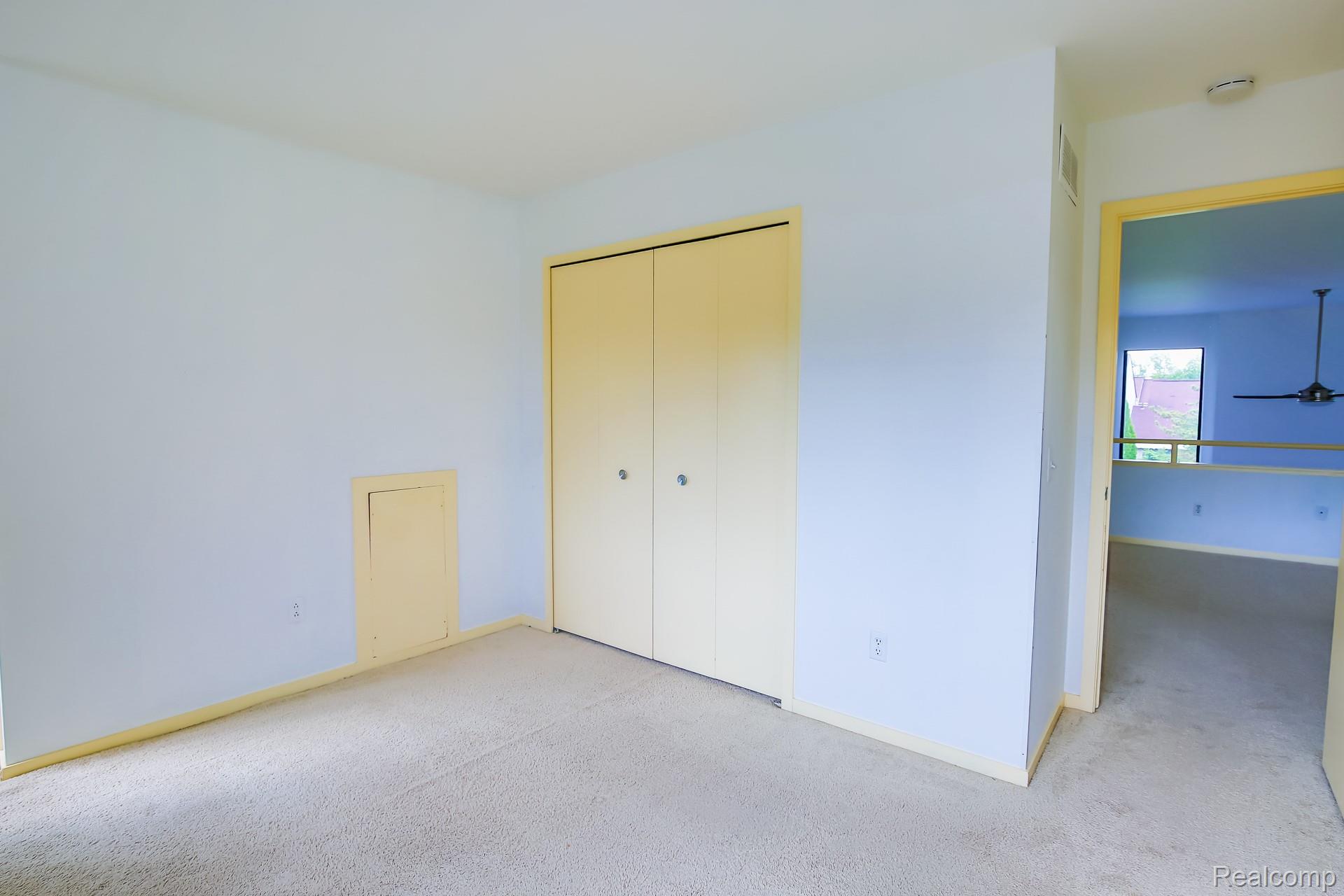 716 Eton Court Rochester, MI 48307 - Photo 18 of 41 Wall-to-wall carpeting and built-in bi-fold closet doors in the 2nd bedroom