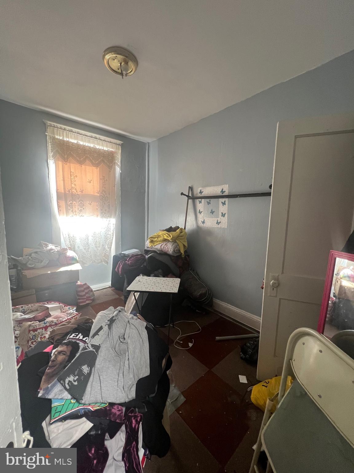 4506 Reisterstown Road Baltimore, MD 21215 - Photo 3 of 22 a bedroom with a bed and a window