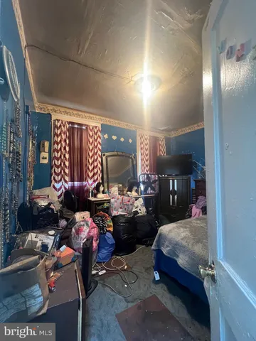 a bedroom with furniture and a chandelier