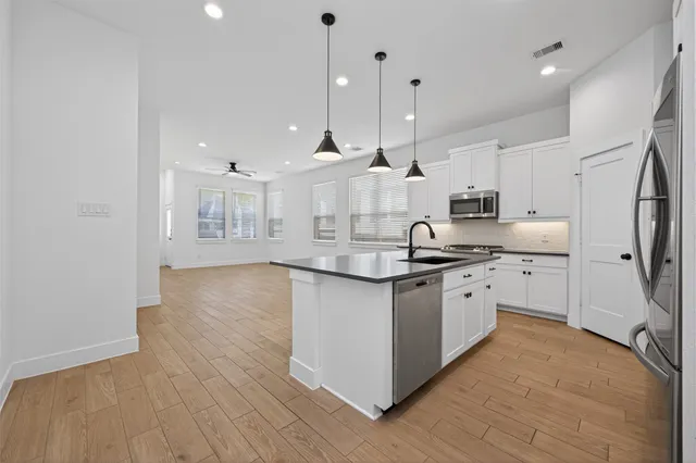 a view of a house with a yard and porch