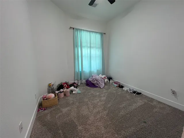 a room with bed and window