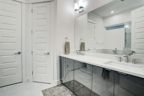 a bathroom with a sink vanity and a mirror