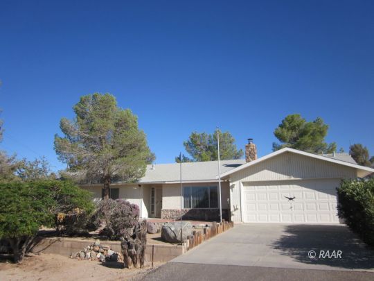 2127 West Ridgecrest Boulevard Ridgecrest, CA 93555 - Photo 2 of 30 a front view of a house with a yard