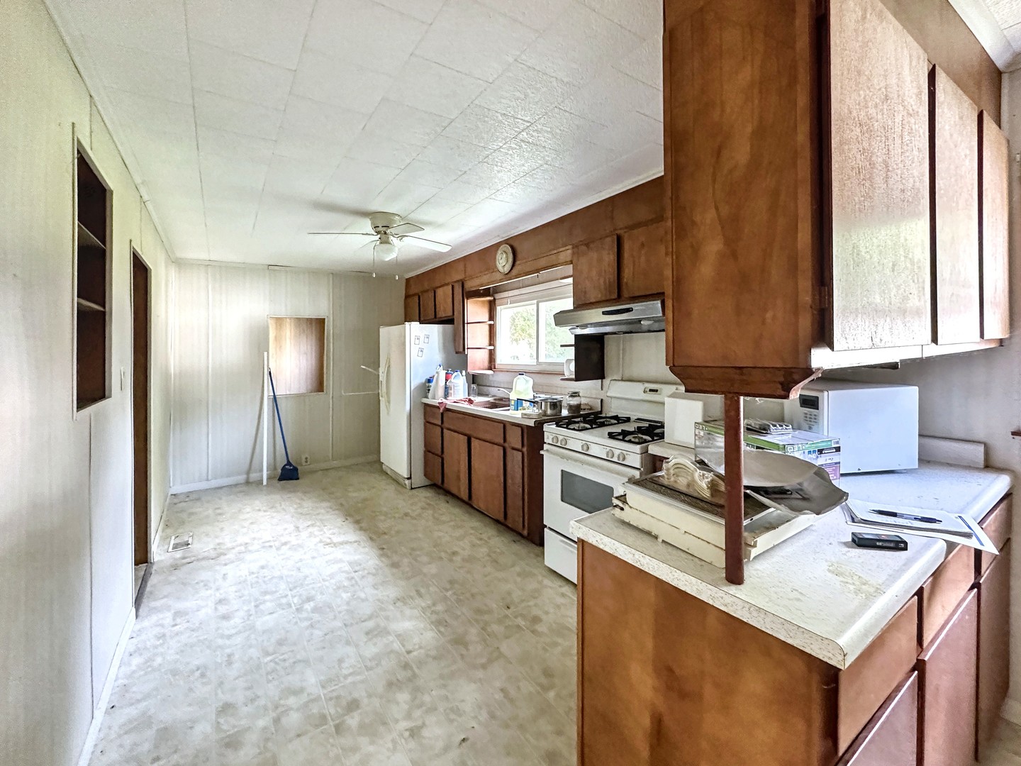 615 South Central Street Gilman, IL 60938 - Photo 3 of 10 a kitchen with stainless steel appliances granite countertop a sink stove and refrigerator