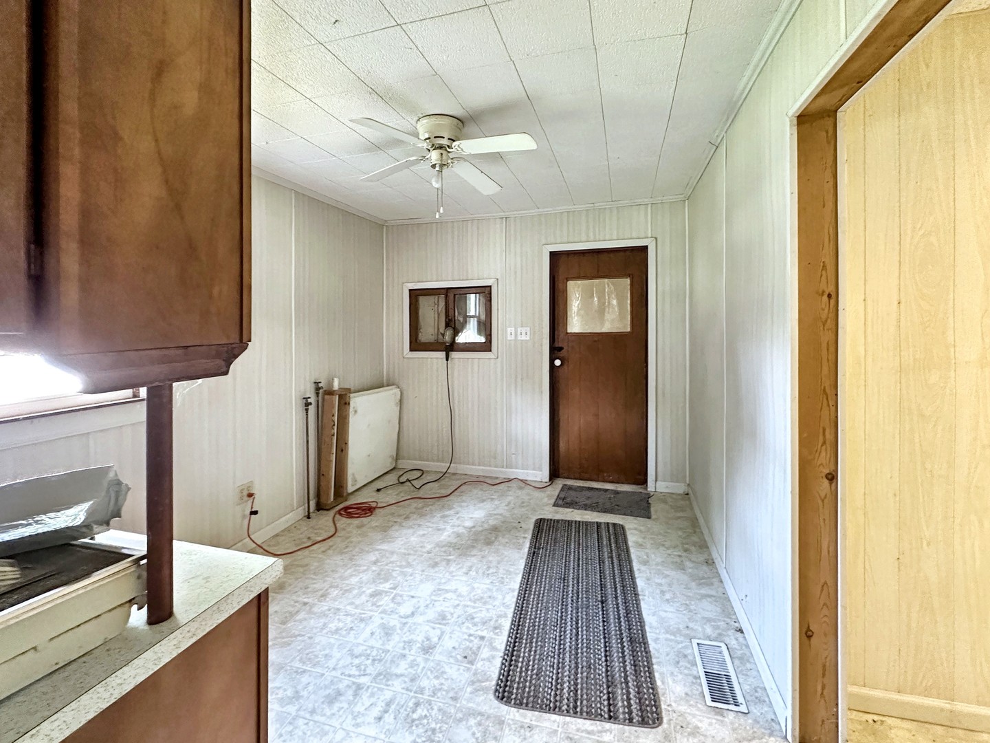 615 South Central Street Gilman, IL 60938 - Photo 4 of 10 a view of a hallway with wooden floor and staircase