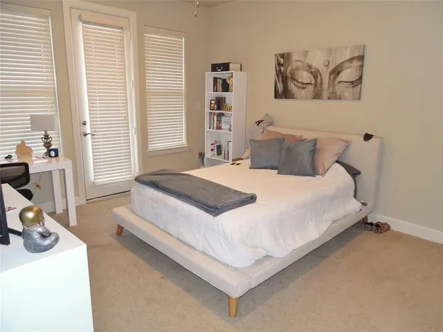 a bedroom with bed and window