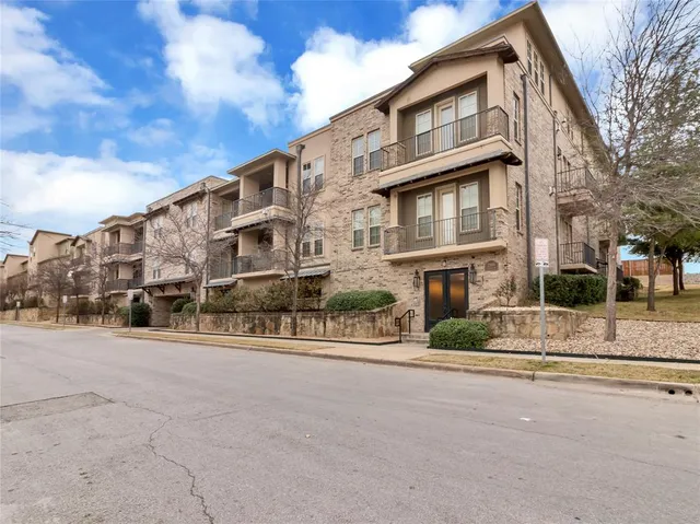 a front view of a building with a street