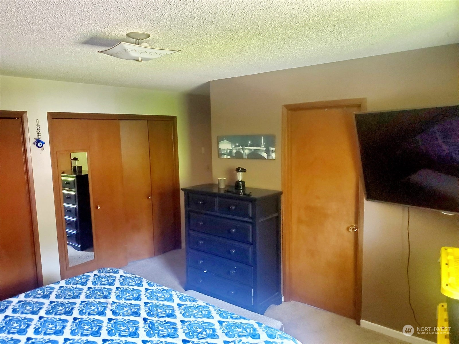 4403 Thomson Avenue Everett, WA 98203 - Photo 13 of 18 a bedroom with a bed and a dresser