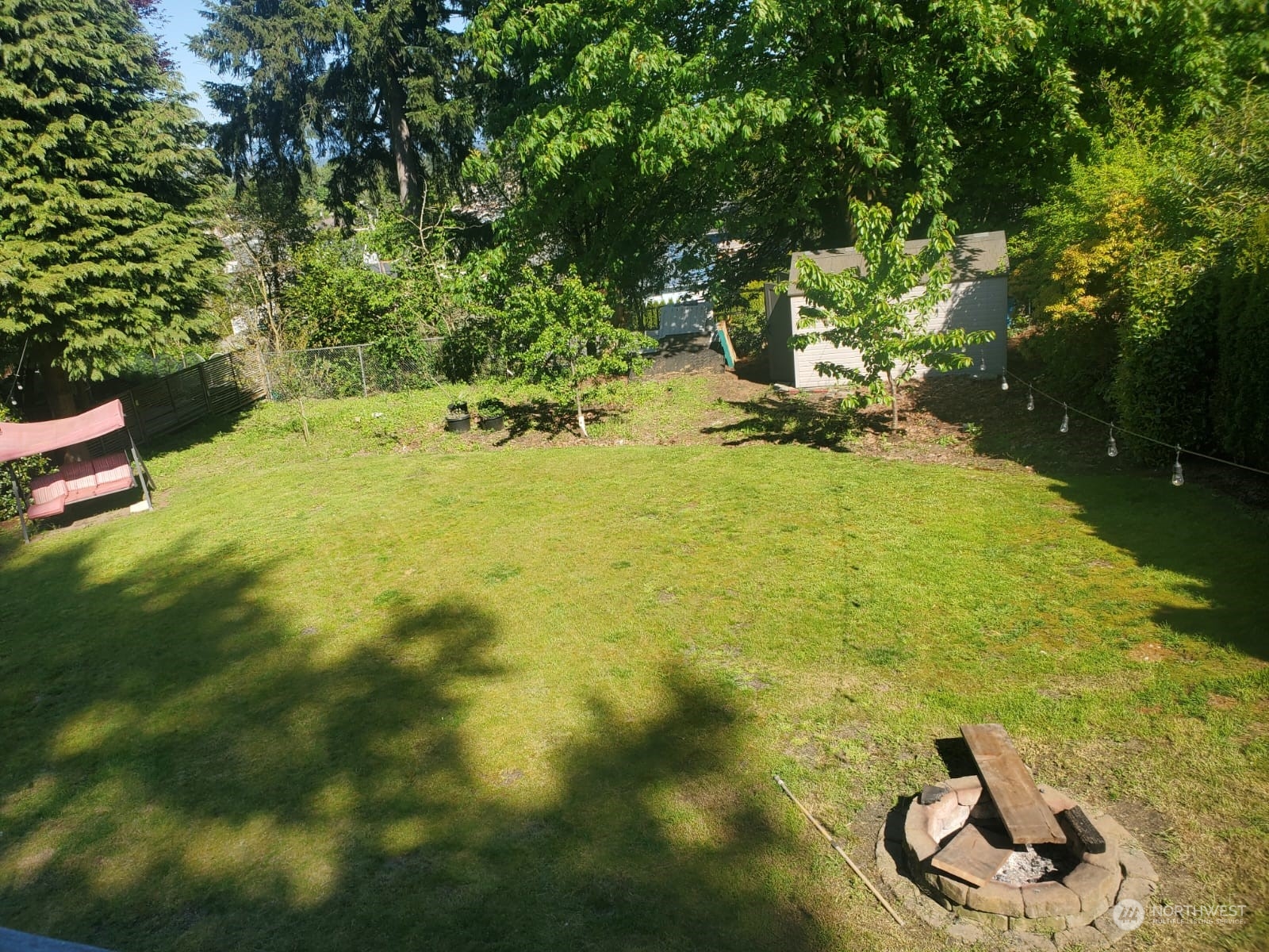 4403 Thomson Avenue Everett, WA 98203 - Photo 16 of 18 a view of a swimming pool with an outdoor seating and yard
