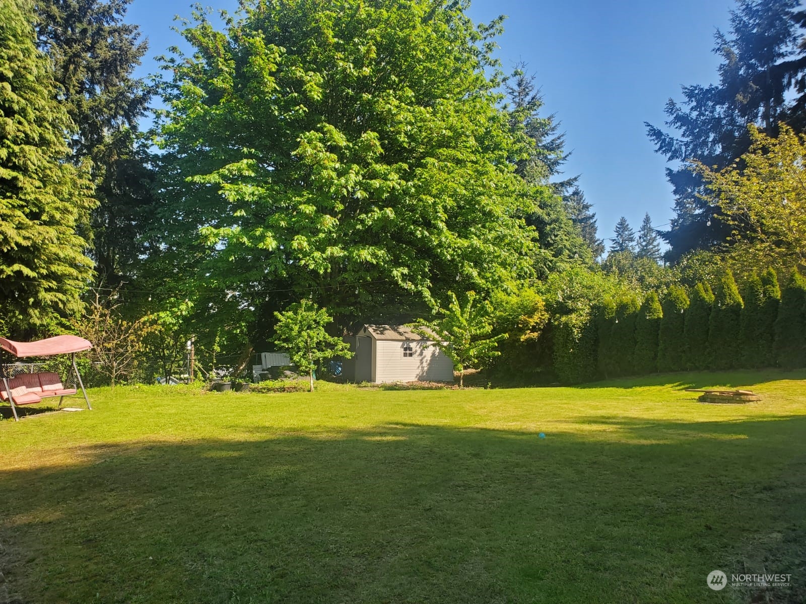 4403 Thomson Avenue Everett, WA 98203 - Photo 17 of 18 a view of a swimming pool with an outdoor space and seating area