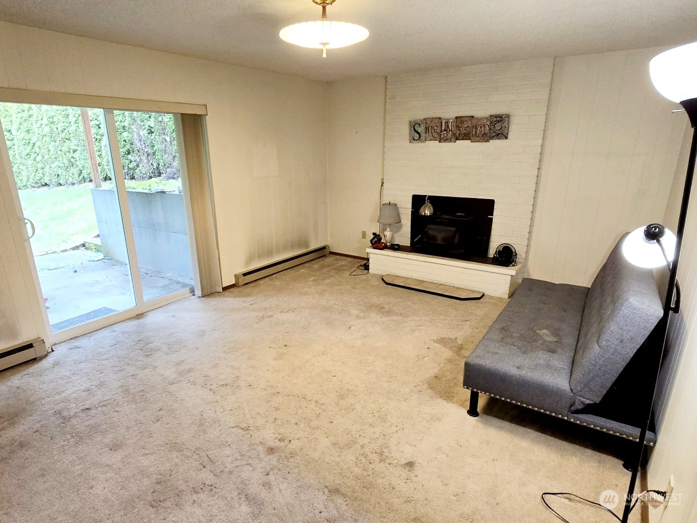 4403 Thomson Avenue Everett, WA 98203 - Photo 10 of 18 a living room with furniture and a fireplace