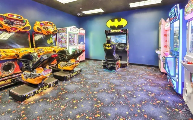 a view of gym equipment with large windows