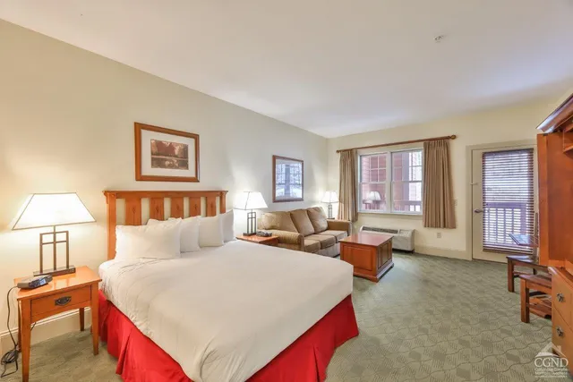 a bed room with a bed and a couch