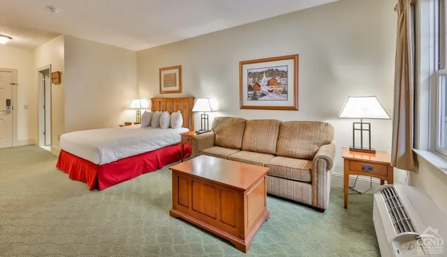 a living room with furniture and a couch