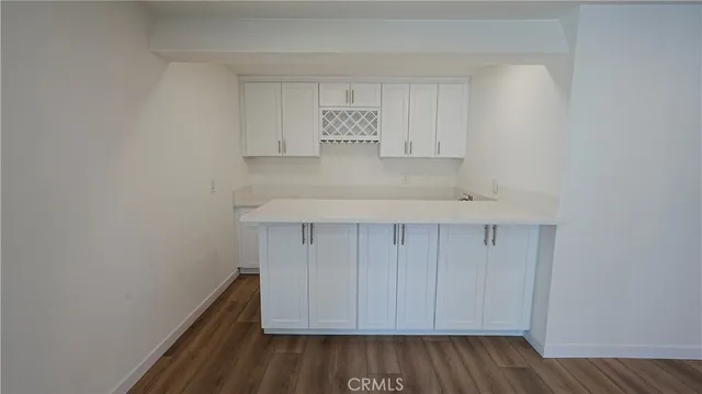 a view of storage and utility room in wooden floor