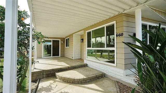a view of a porch with furniture