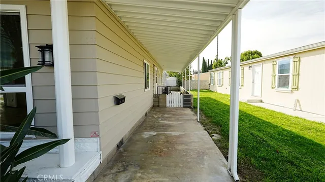 a view of a porch with wooden floor and stairs