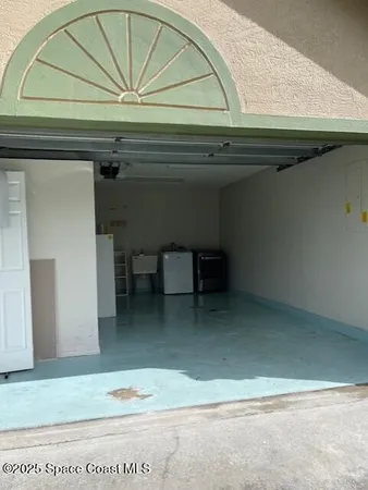a kitchen with a sink and a microwave