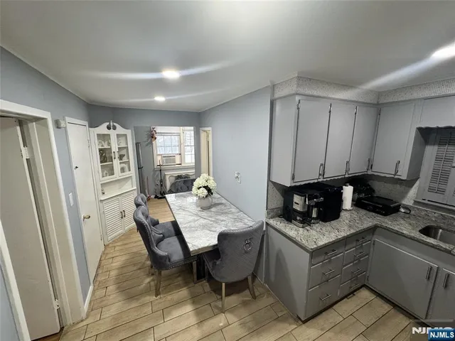 a kitchen with a refrigerator and stove