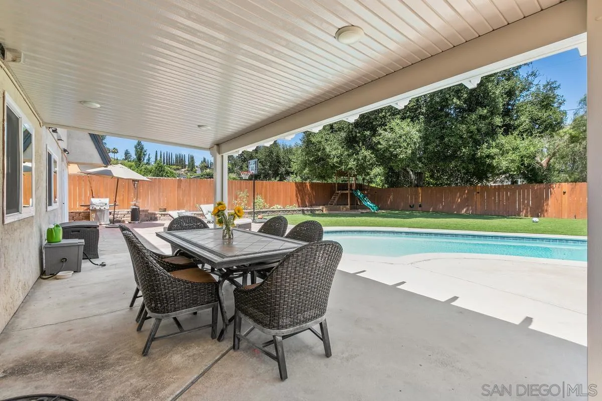 14437 Hillndale Way Poway, CA 92064 - Photo 22 of 35 a dining room with a table and chairs