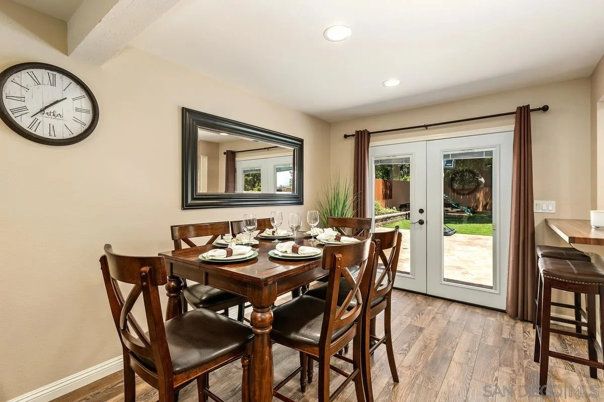 14437 Hillndale Way Poway, CA 92064 - Photo 6 of 35 a view of a dining room with furniture window and wooden floor