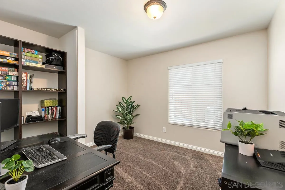 14437 Hillndale Way Poway, CA 92064 - Photo 10 of 35 a living room with furniture and a potted plant