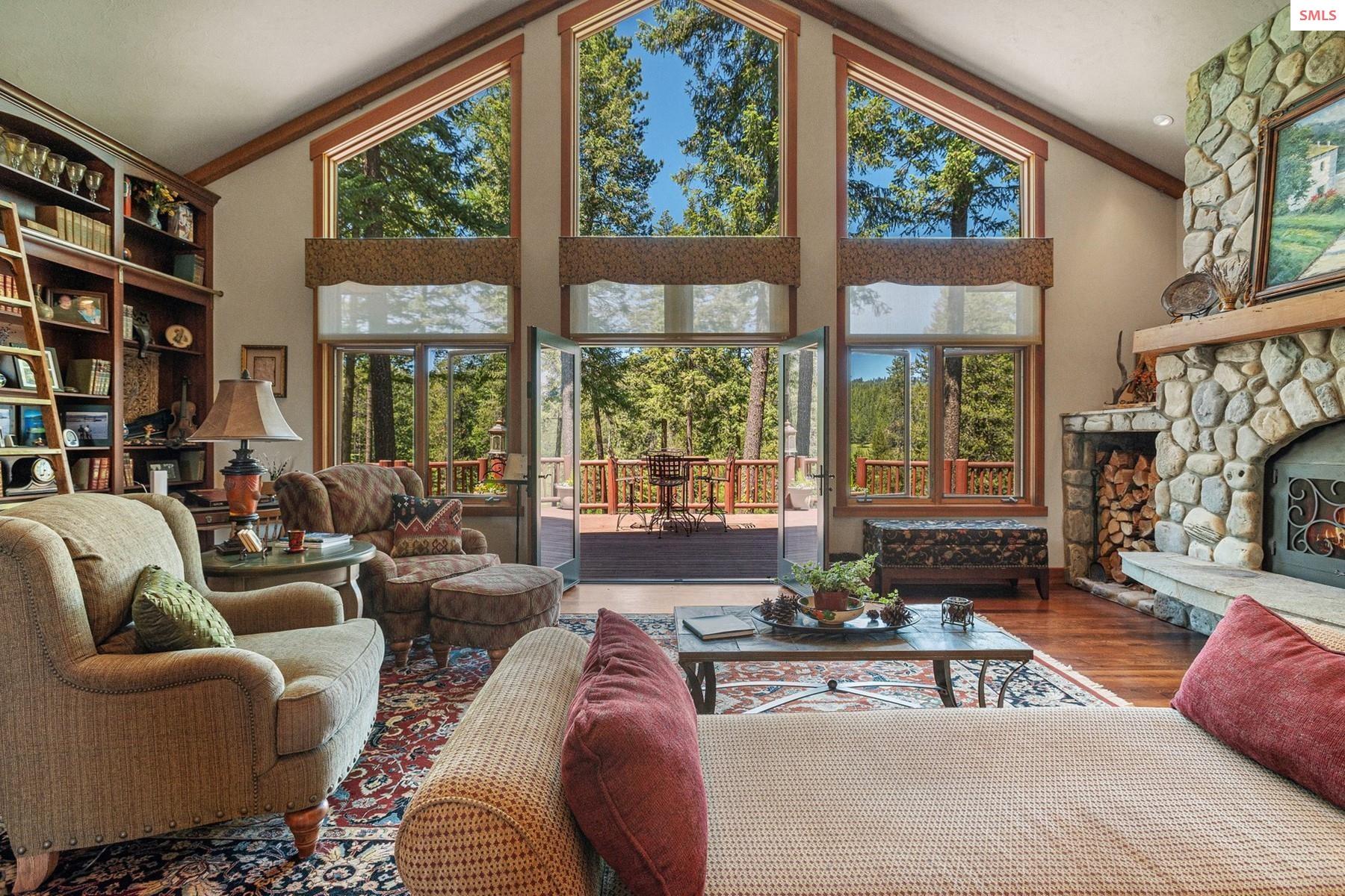 526 Roop Road Cocolalla, ID 83813 - Photo 6 of 100 Upstairs great room with fireplace and built in bookshelf's