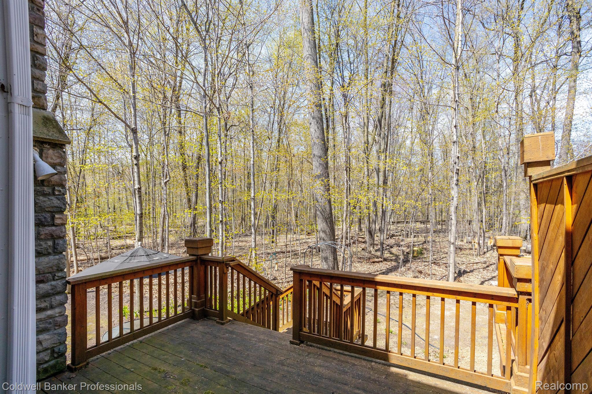 49702 Timber Trail Novi, MI 48374 - Photo 6 of 36 deck and wooded area