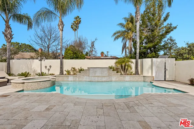 a living room with fireplace furniture and a couch