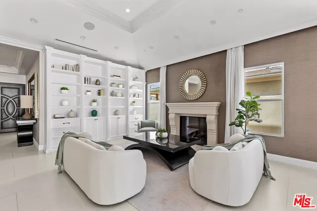 a kitchen with kitchen island a counter top space a sink stainless steel appliances and cabinets