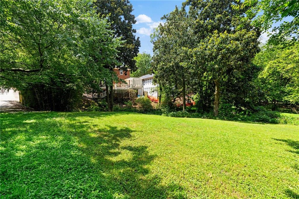 1118 Austin Avenue Northeast Atlanta, GA 30307 - Photo 11 of 12 a view of a backyard with large trees