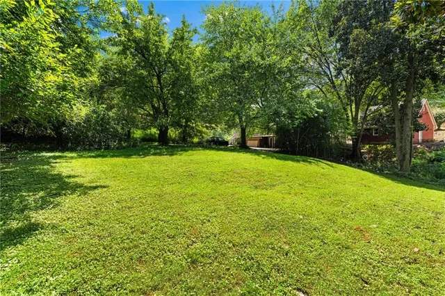 a swimming pool with wooden fence