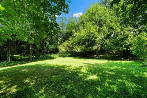 a swimming pool with wooden fence