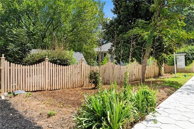 a backyard of a house with lots of green space