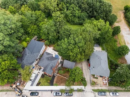 an aerial view of a house with outdoor space and street view