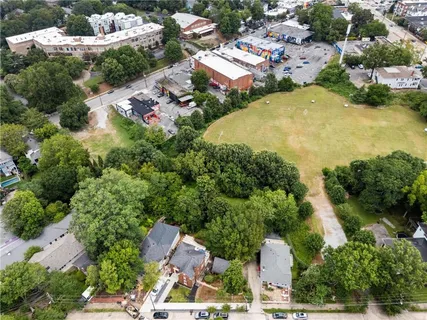 an aerial view of a house with a yard and garden space