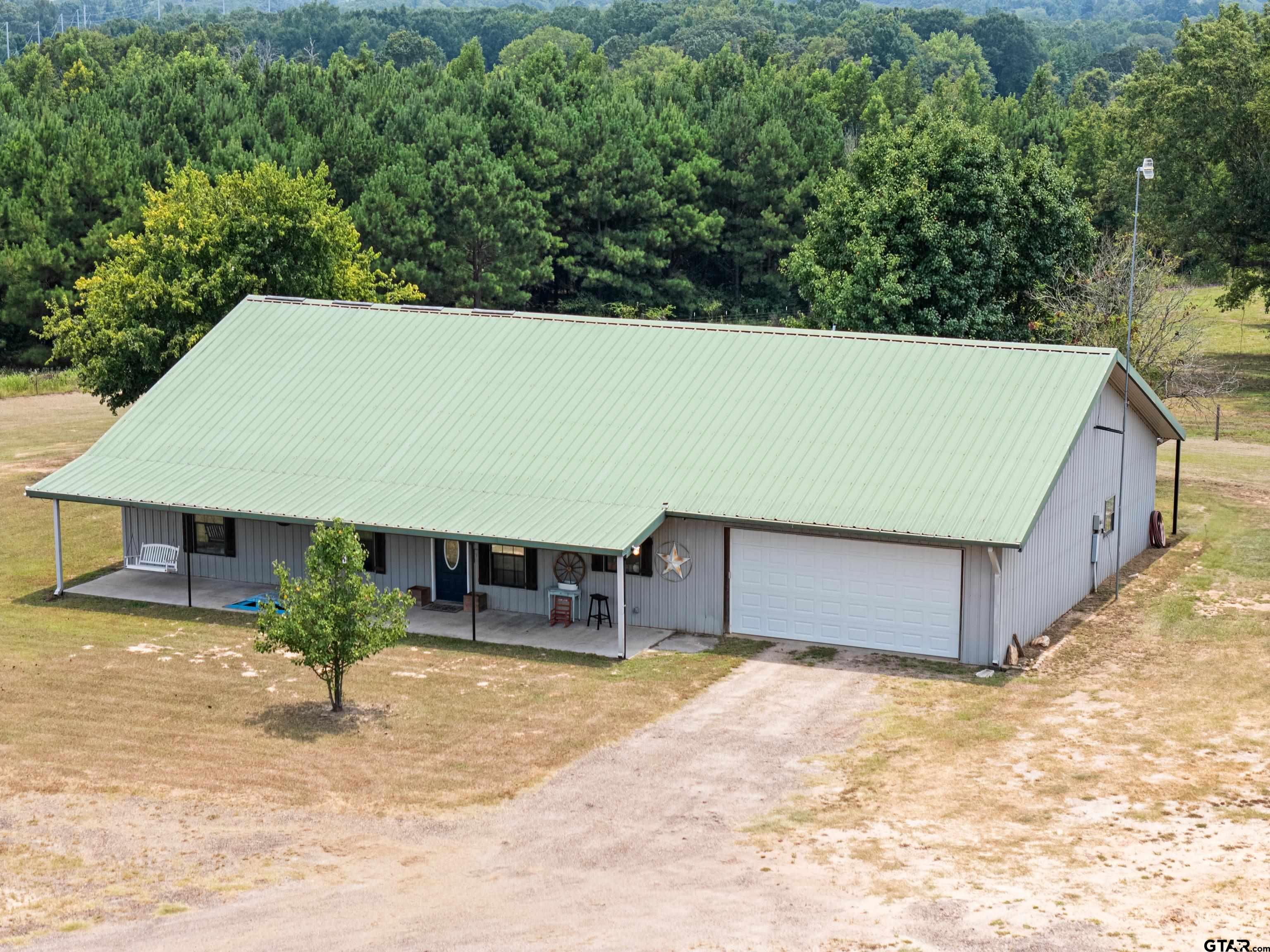 423 County Road 4306 Naples, TX 75568 - Photo 13 of 47 a view of a backyard