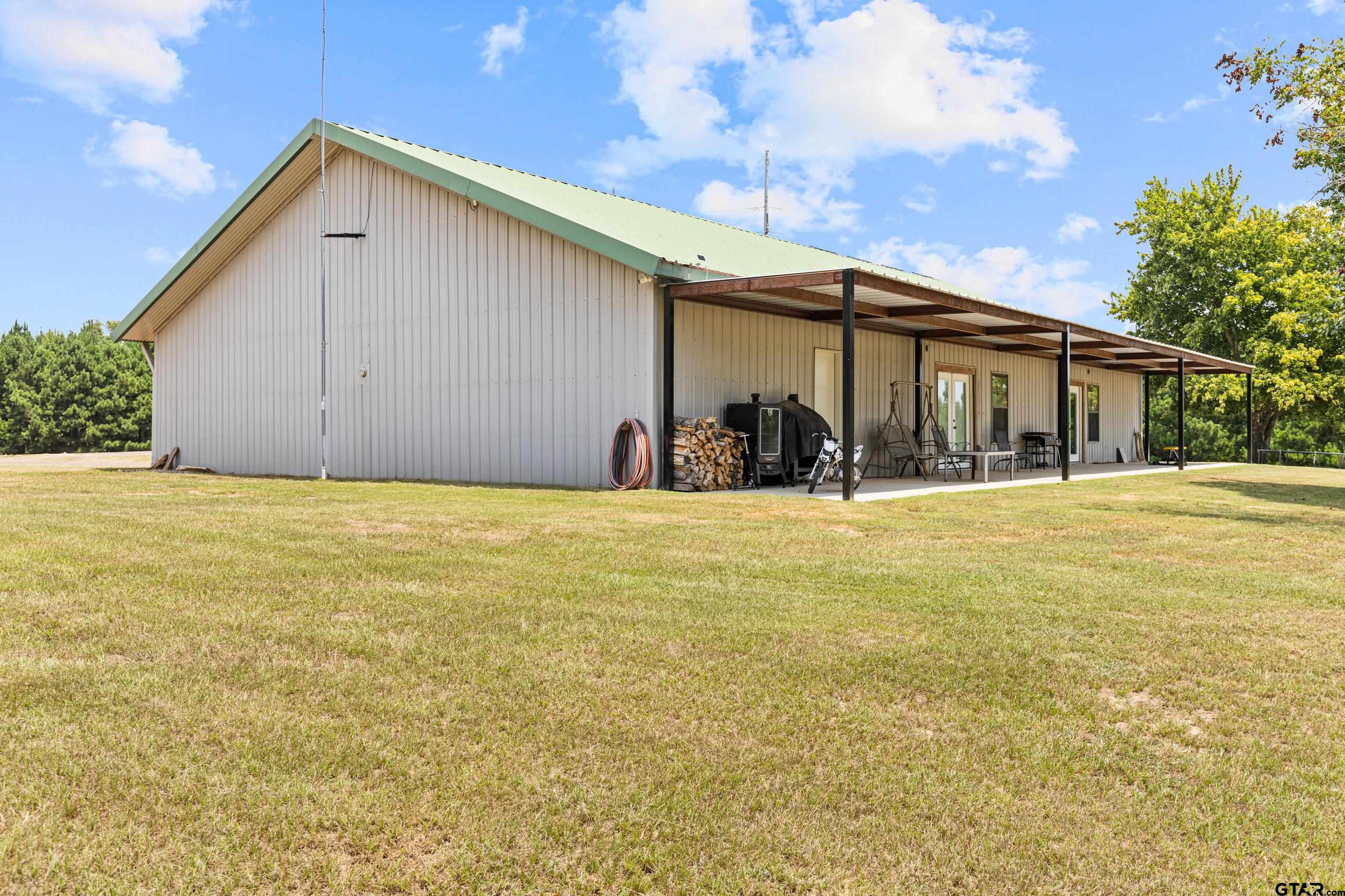 423 County Road 4306 Naples, TX 75568 - Photo 16 of 47 a view of house with yard