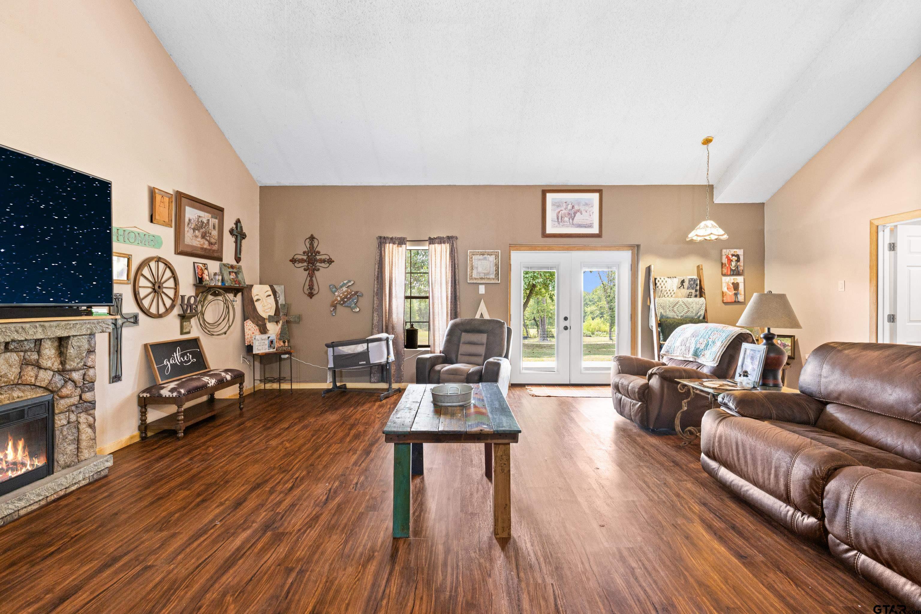 423 County Road 4306 Naples, TX 75568 - Photo 26 of 47 a living room with furniture and a wooden floor