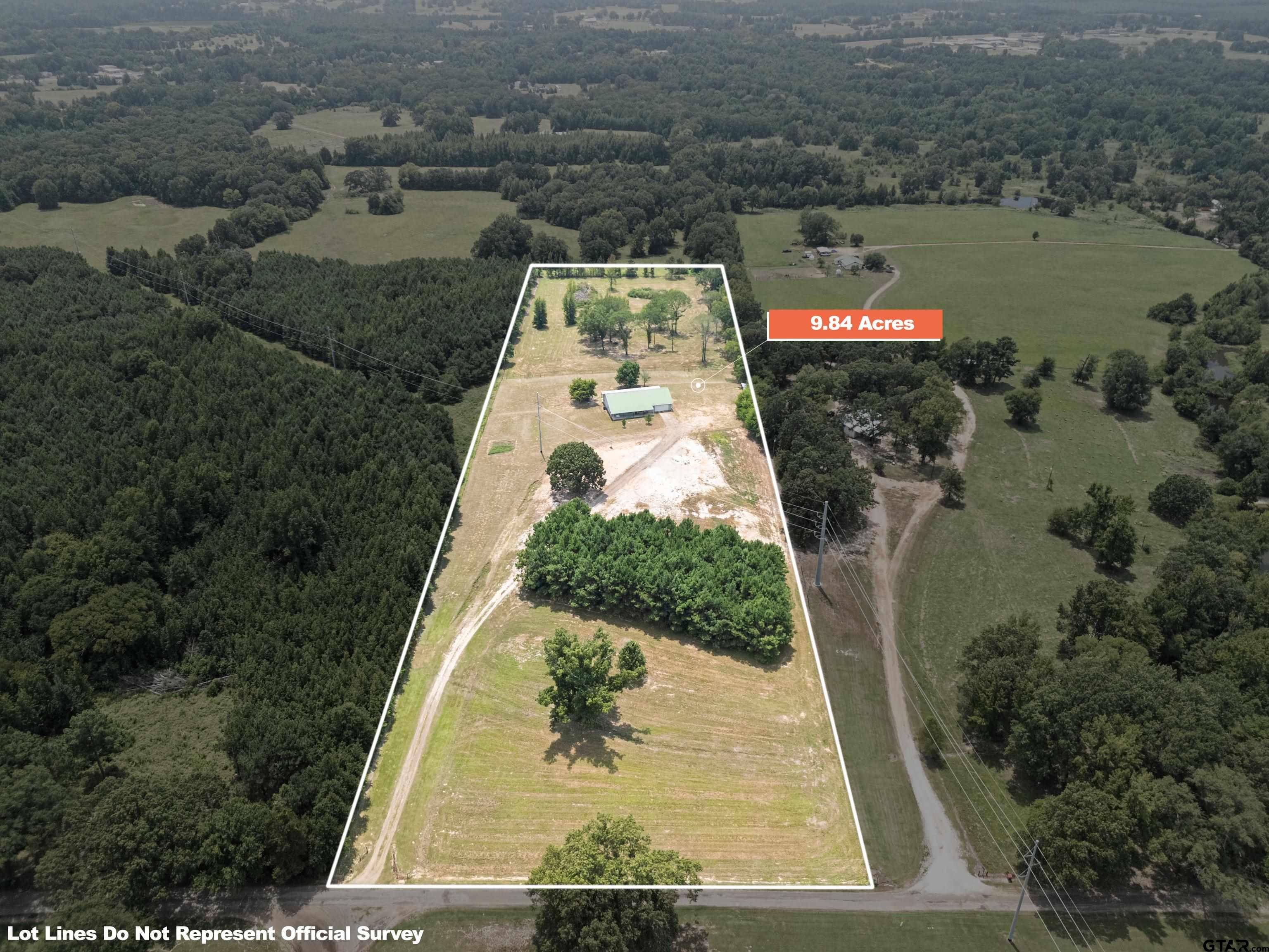 423 County Road 4306 Naples, TX 75568 - Photo 3 of 47 an aerial view of a house