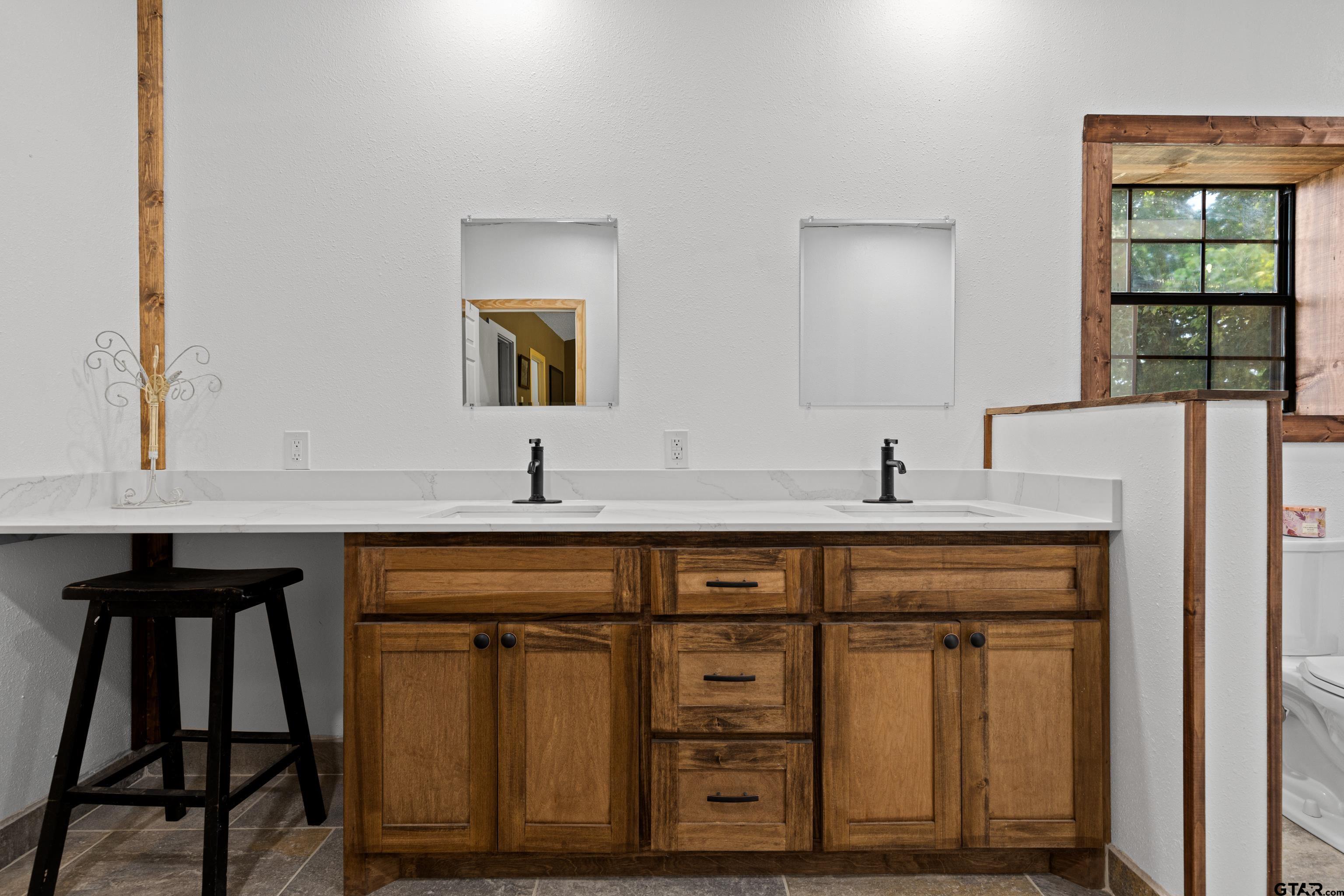 423 County Road 4306 Naples, TX 75568 - Photo 36 of 47 a kitchen with a sink cabinets and a window